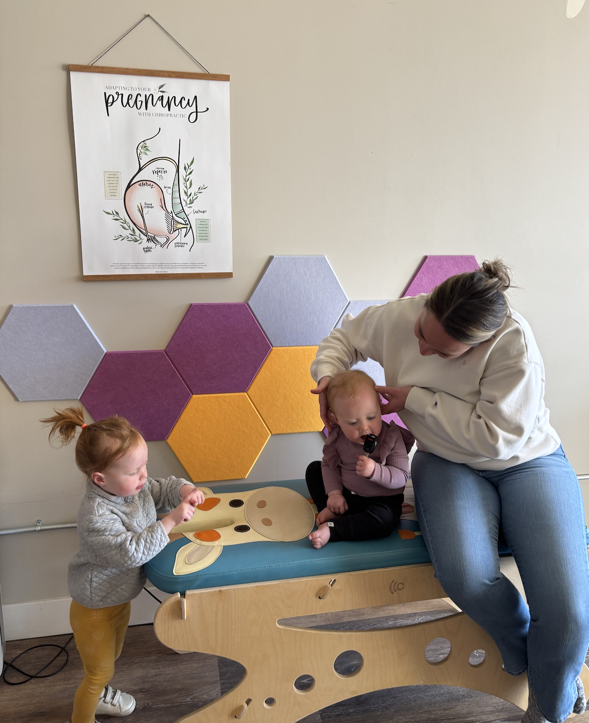 Child receiving gentle pediatric chiropractic adjustment at Calmbody Chiropractic Club